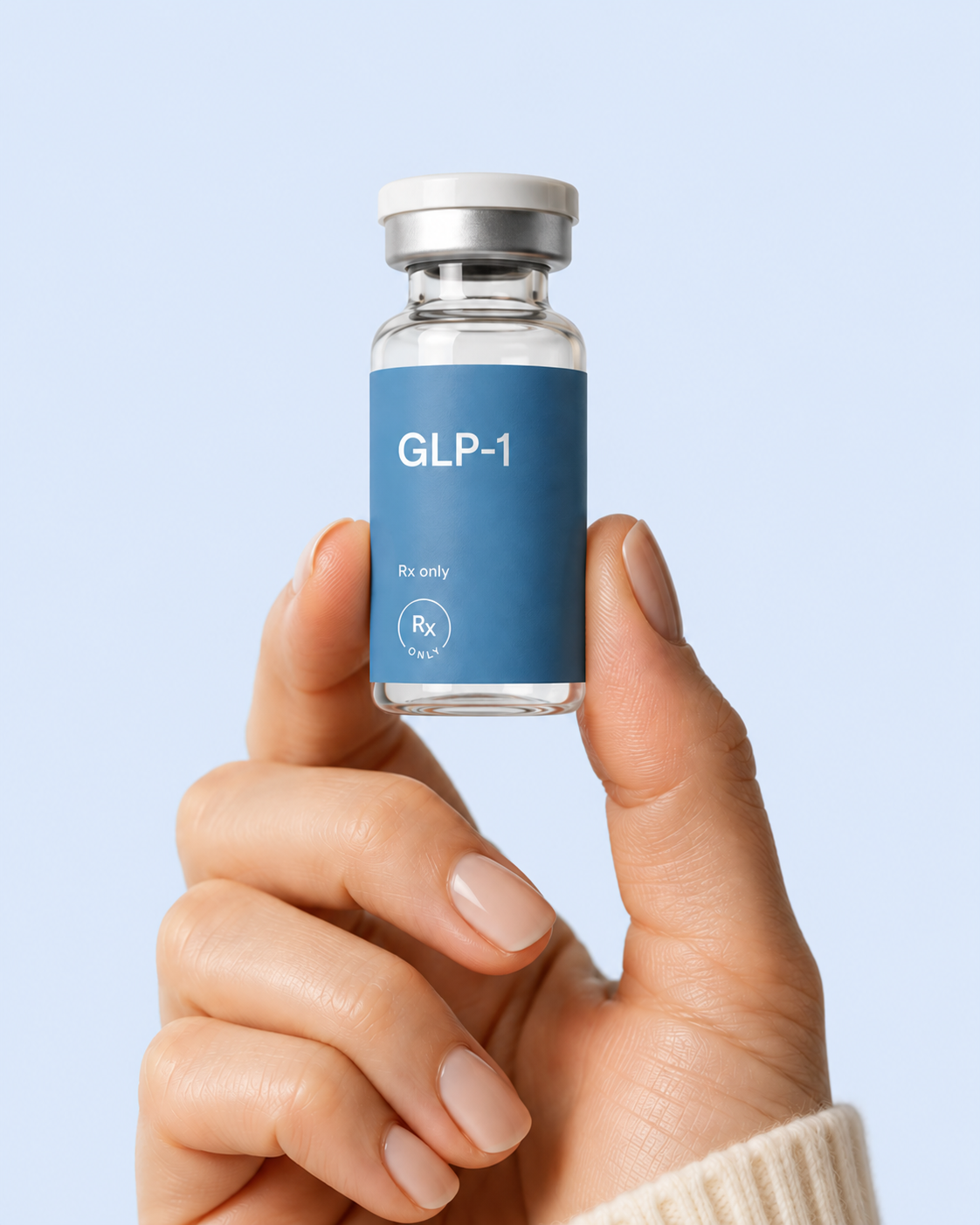 Hand holding a GLP-1 injection vial