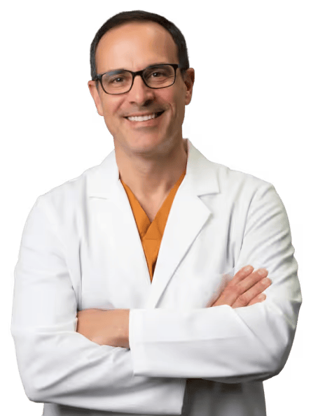 Physician standing with arms crossed