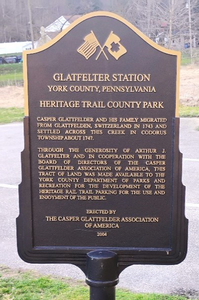 The Glatfelter Station parking lot sign noting that Casper and his family migrated from Glattfelden, Switzerland, in 1743.