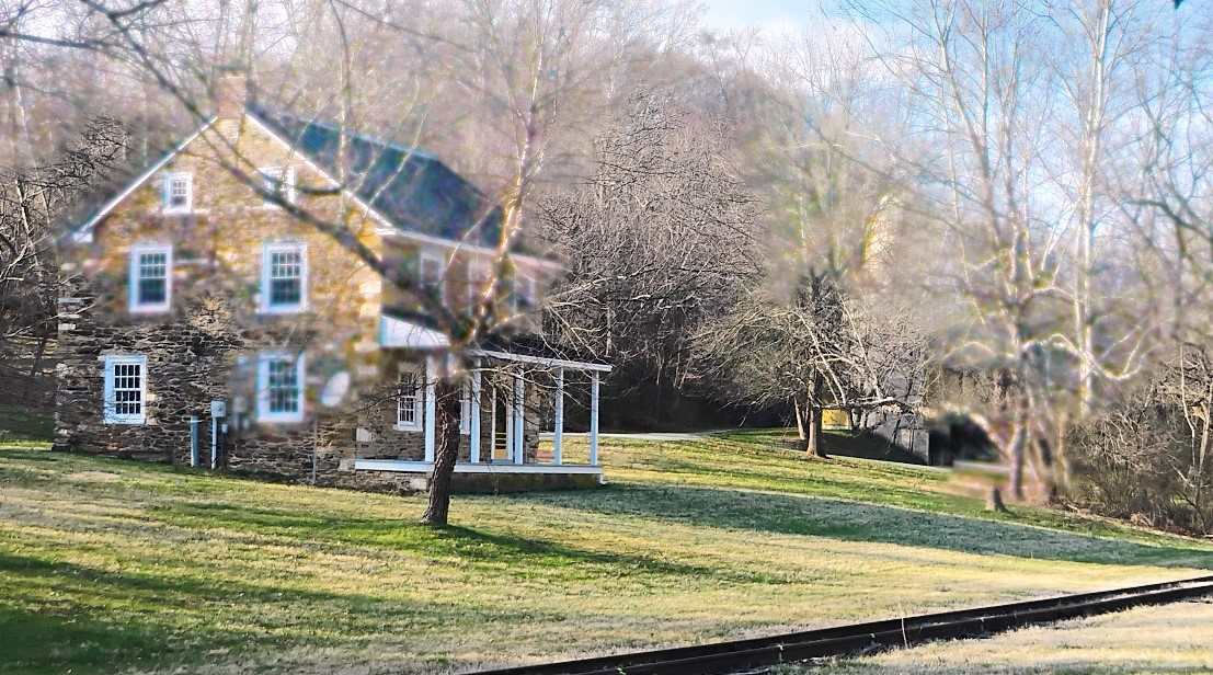 This is a view of Heimwald Park through the leafless trees from the Glatfelter Station parking lot in March. At far left is the Armand Glatfelter Maintenance Building, with the Historical Building in the middle and the pavilion on the right.