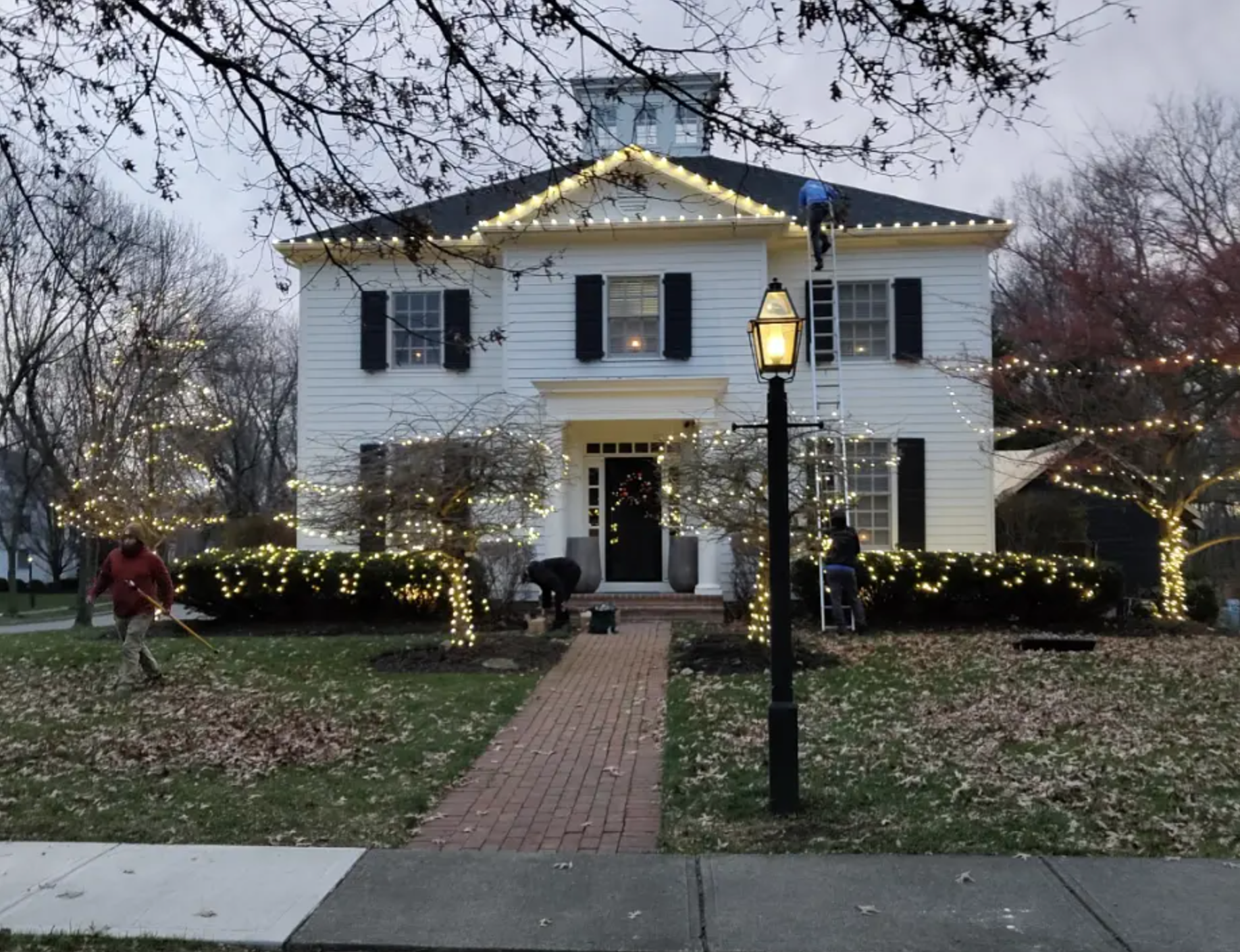 Close-up of commercial-grade C9 Christmas light bulbs along a roofline