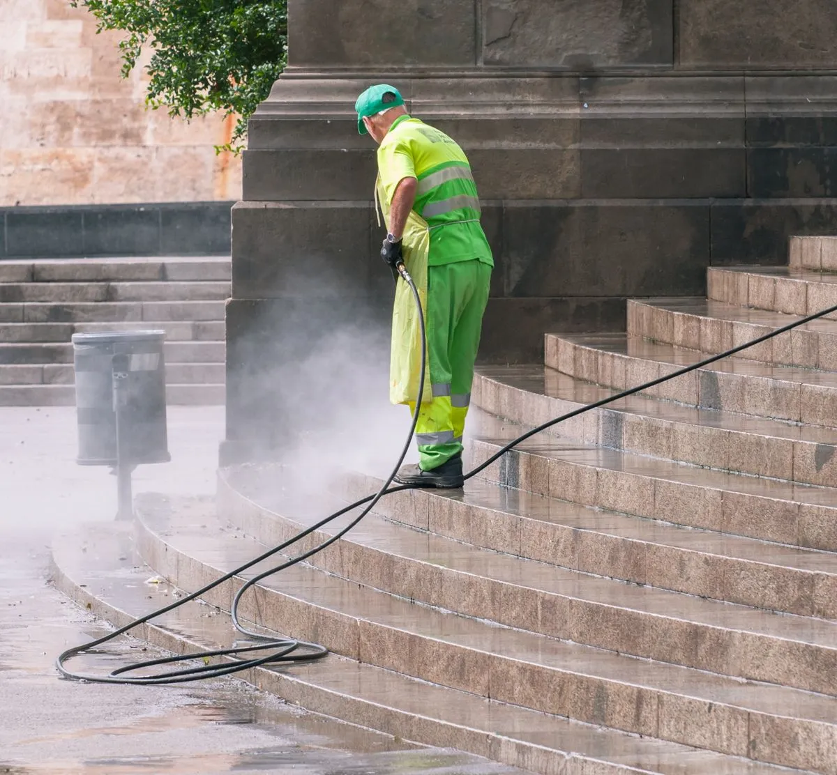 CE Lawn Care technician power washing a residential driveway in Metro Atlanta