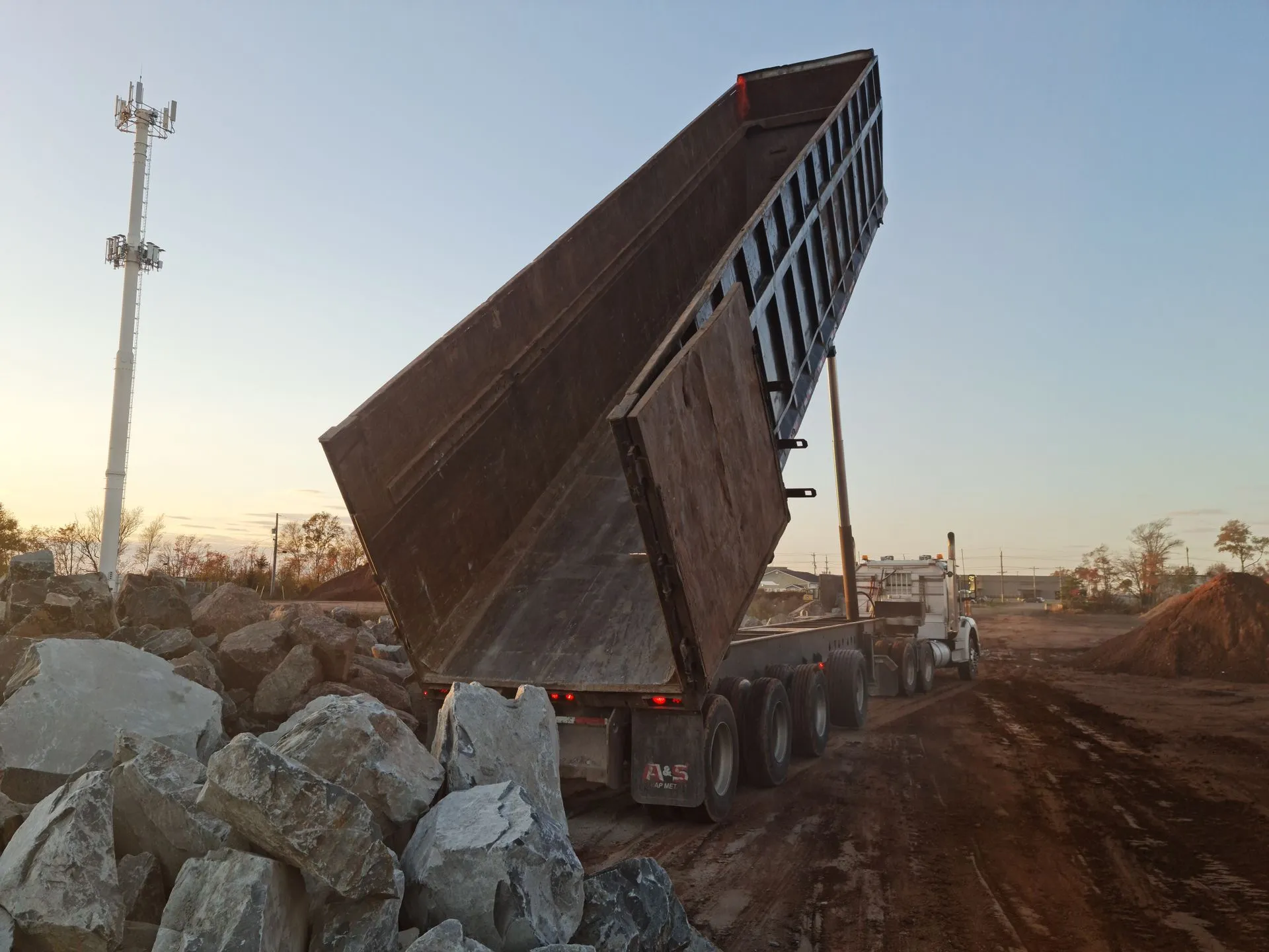 Mr. Grapple debris removal and hauling, dump truck at work site in Atlanta, GA