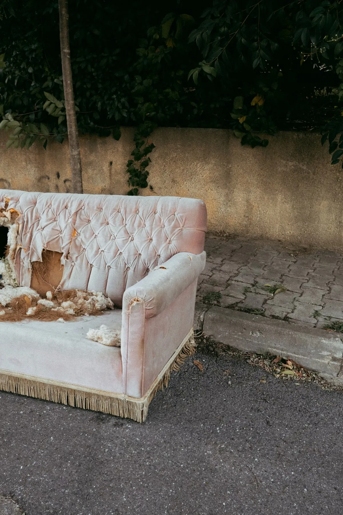 Abandoned sofa left at curb for Mr. Grapple pickup service in Atlanta, GA