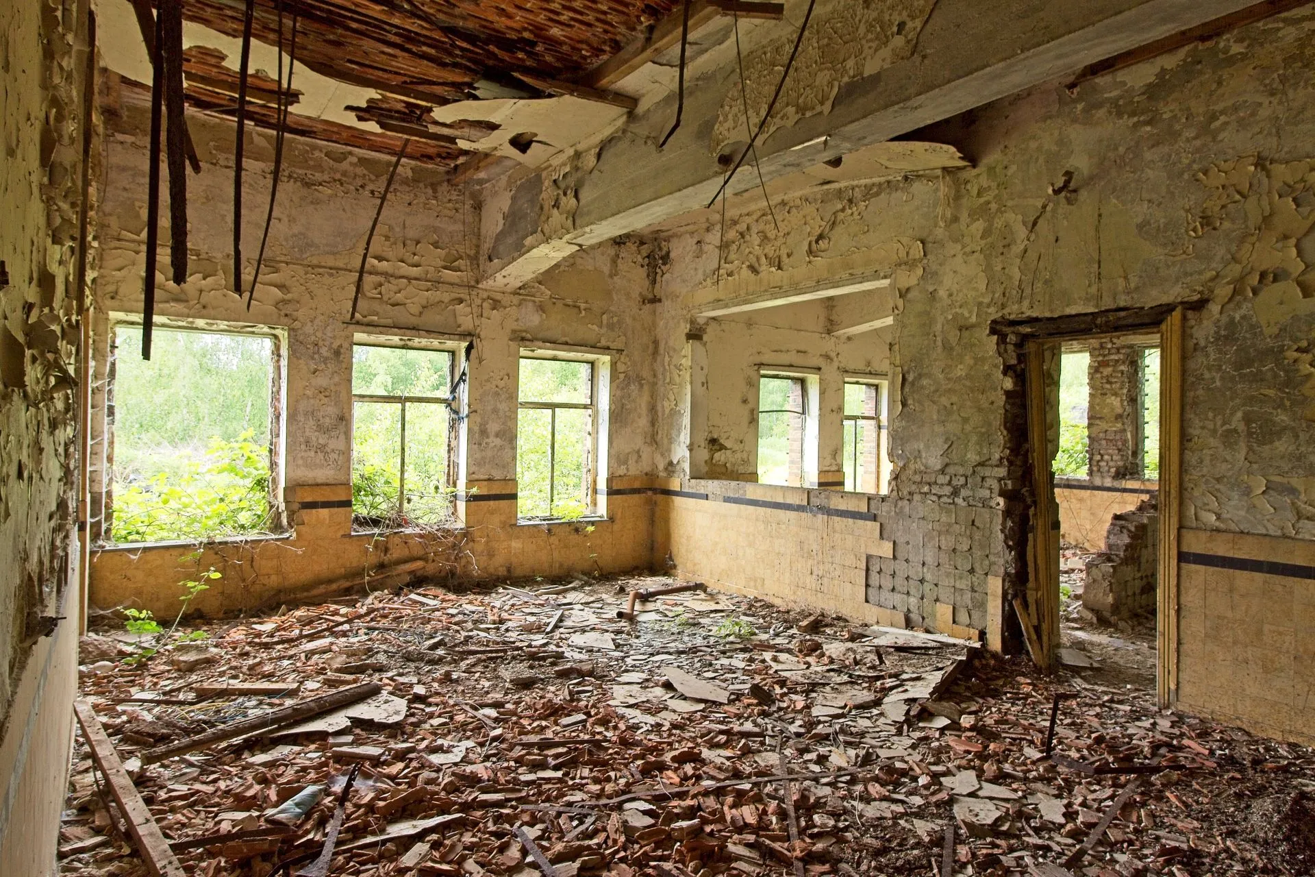 Dilapidated abandoned property with debris, eviction cleanout by Mr. Grapple in Atlanta, GA