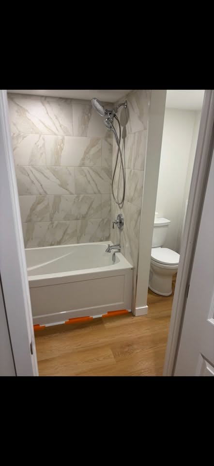 Small bathroom renovation with new tub and tile