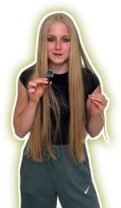 Ava speaking into a microphone