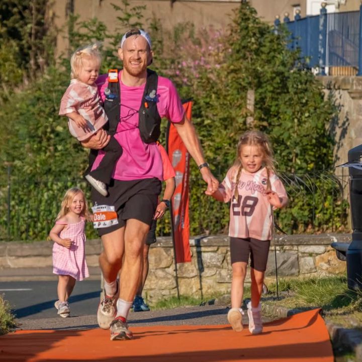 Dale crossing the finish line of his 100km ultra