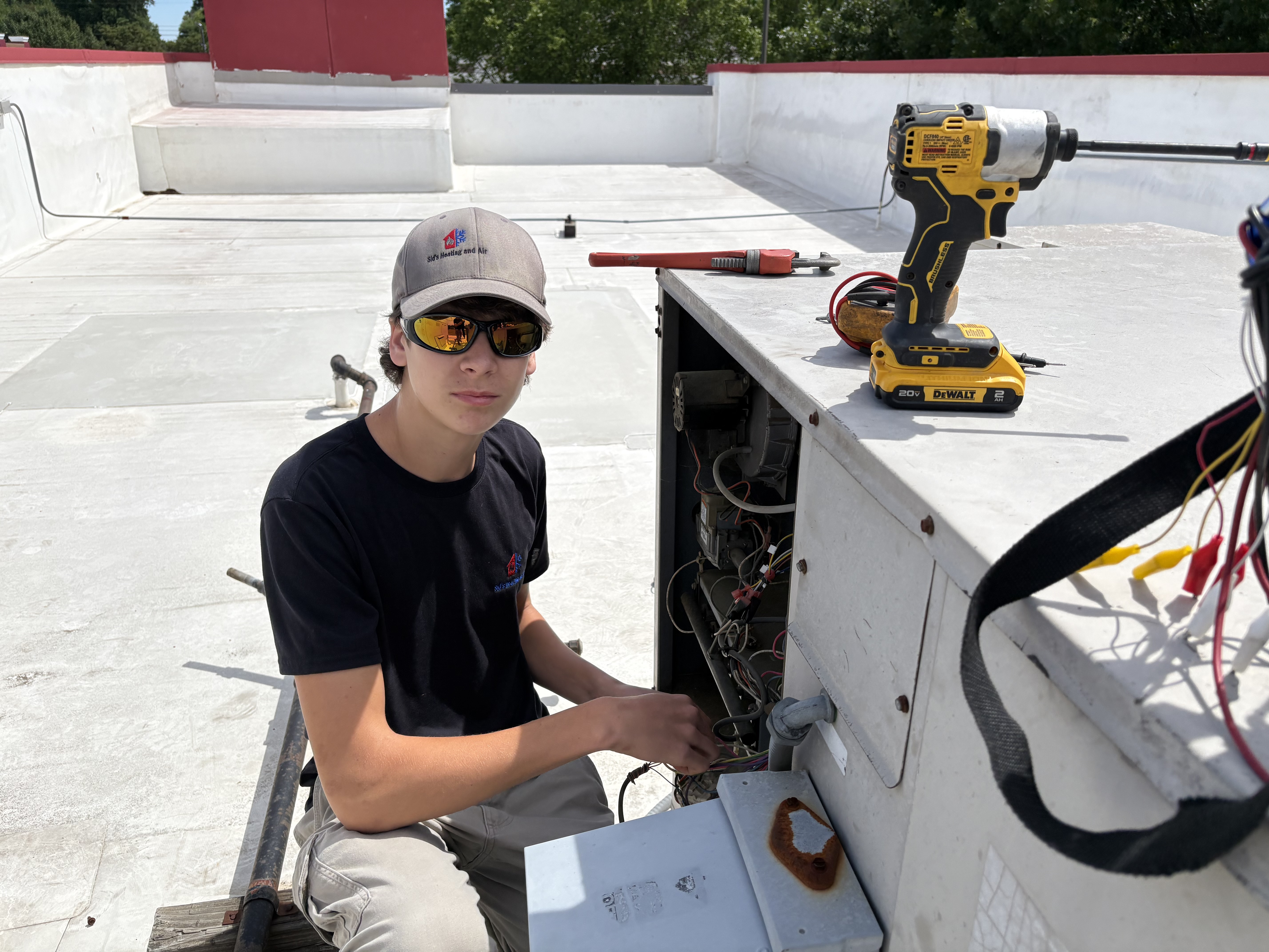 Gene from Sid's Heating and Air performing HVAC maintenance in Monroe NC