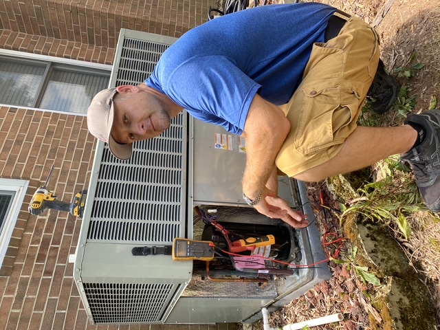 Sid's Heating and Air completing a residential HVAC repair