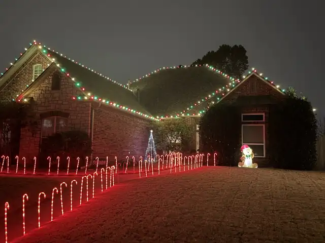 Two-gable brick home after lights