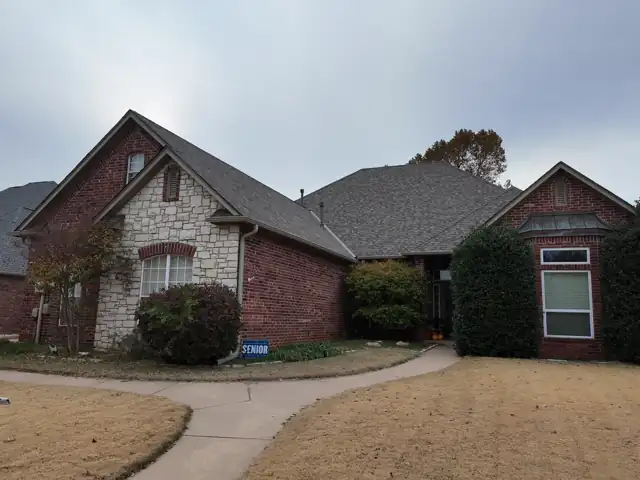 Two-gable brick home before lights