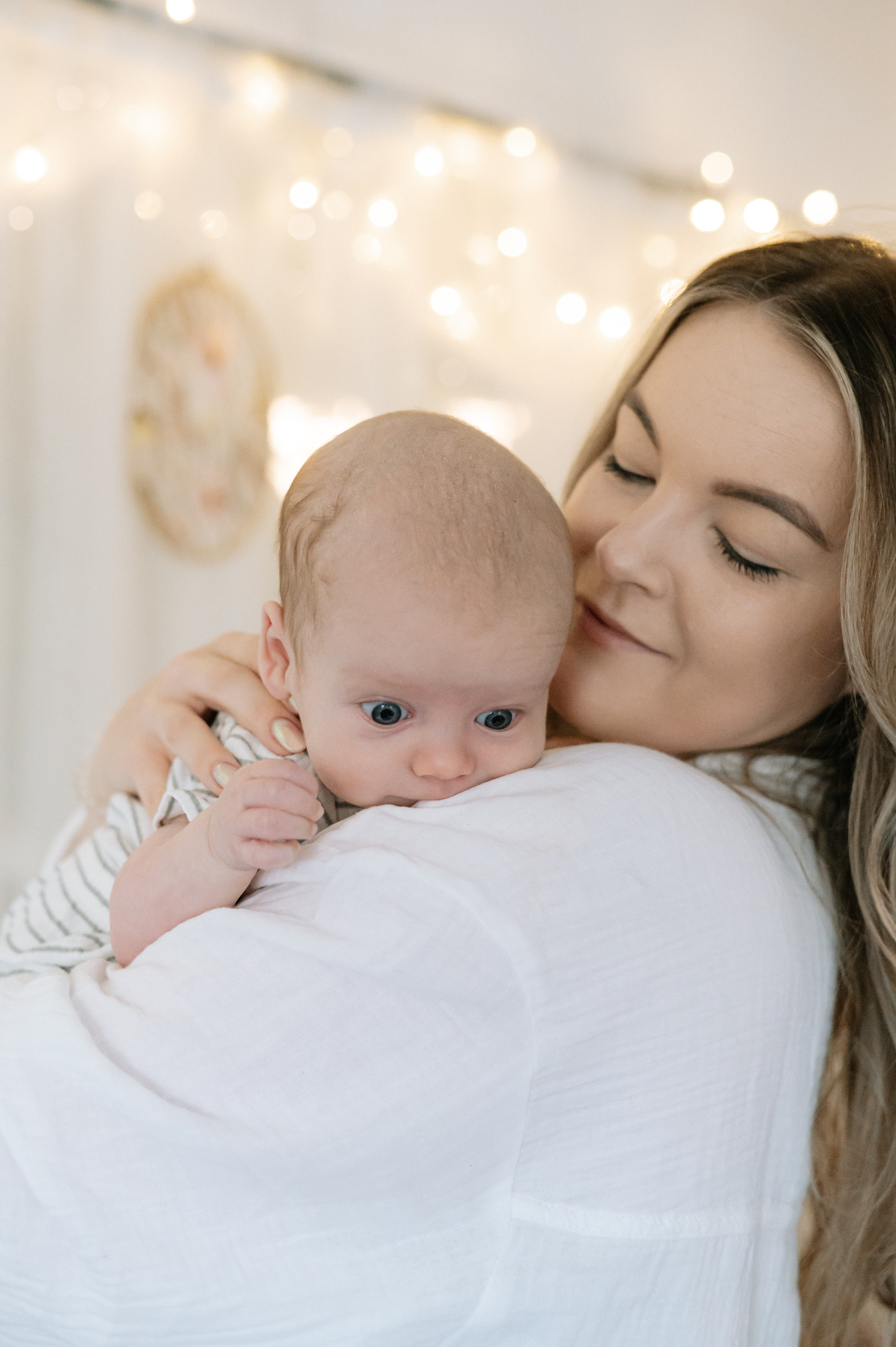 Mum holding her baby during a Little Rosebuds Baby Massage Class