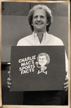 Charlie holding the sign for his television segment, Charlie Mac's Sports Facts