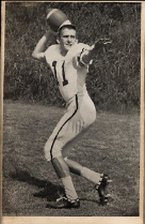 A young Charlie McAlexander throwing a pass in his number 11 jersey