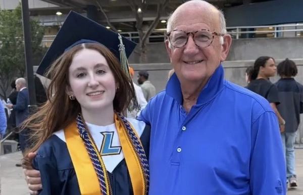 Charlie Mac with his granddaughter Sarah on graduation day