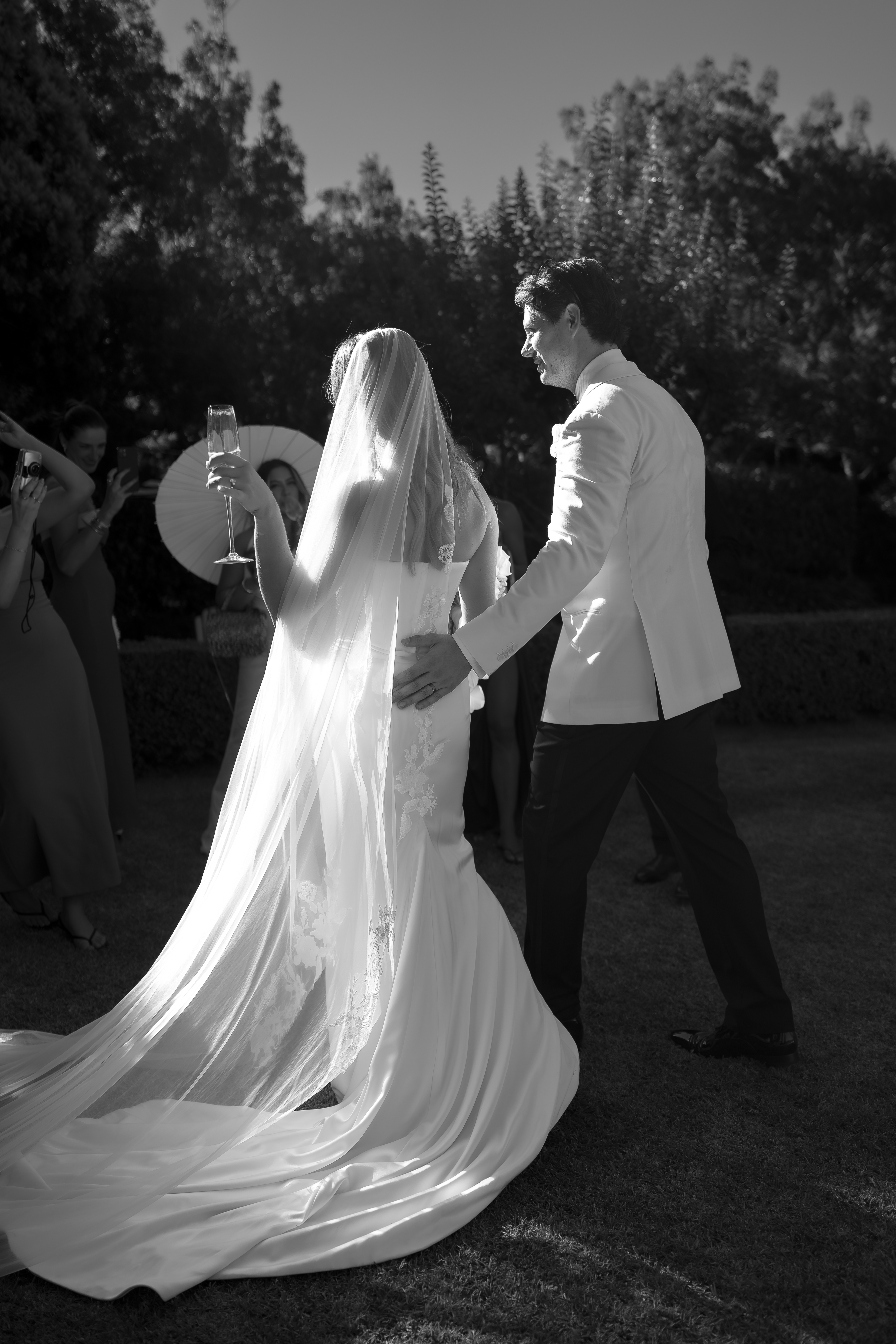 Veil lit at night as the couple walk