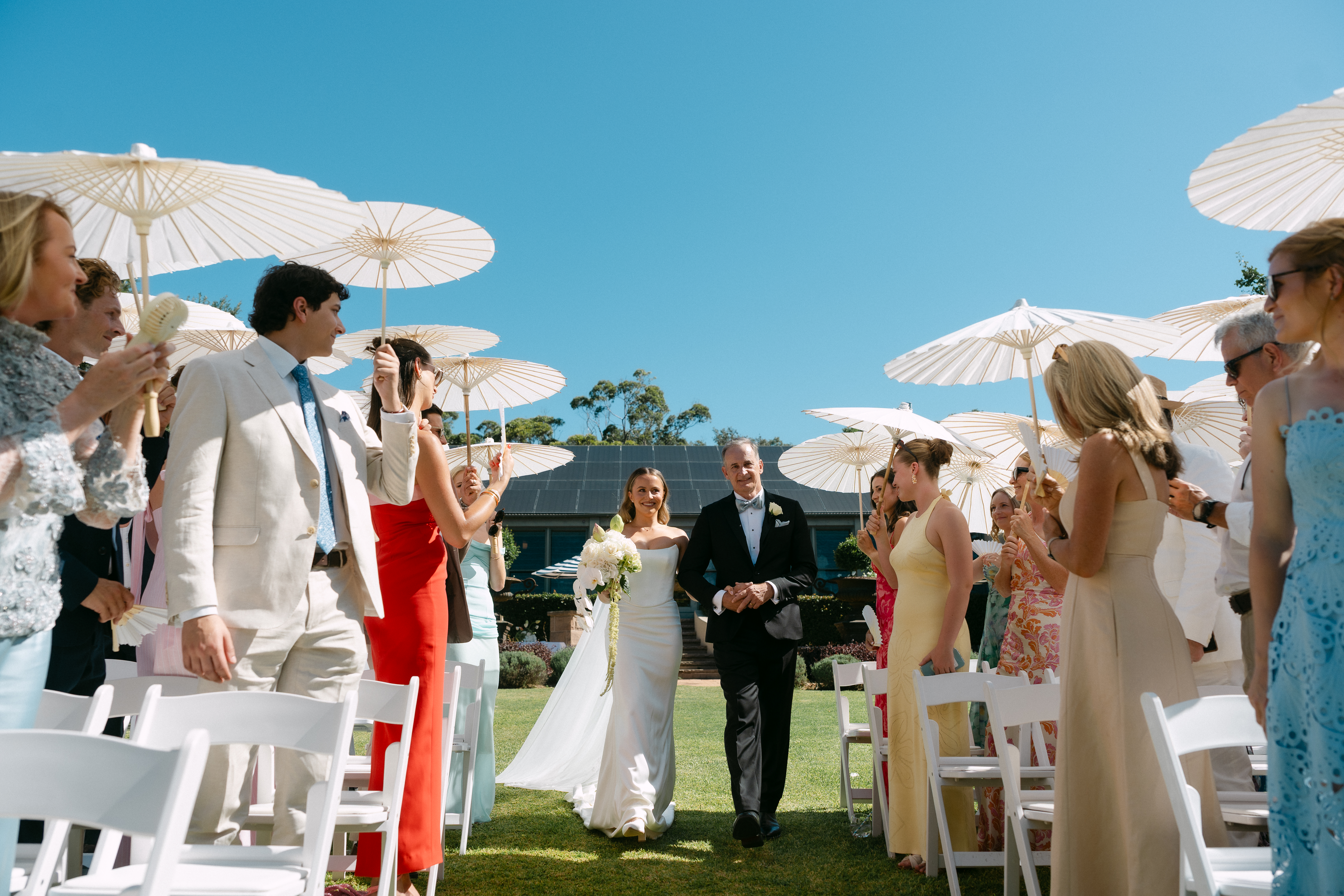 Paper parasols going up over the ceremony