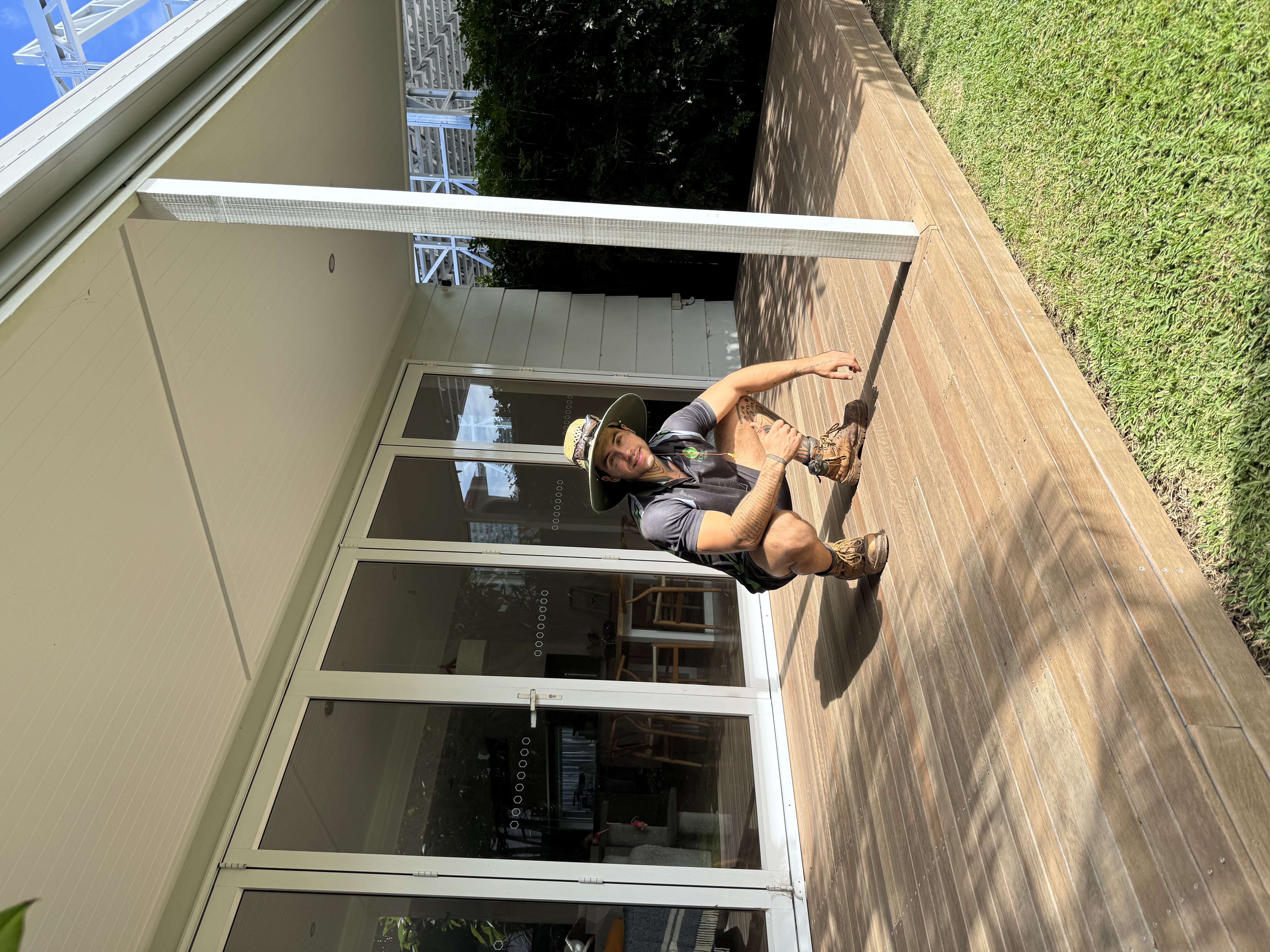 André, owner of Deck Reset, on a restored timber deck