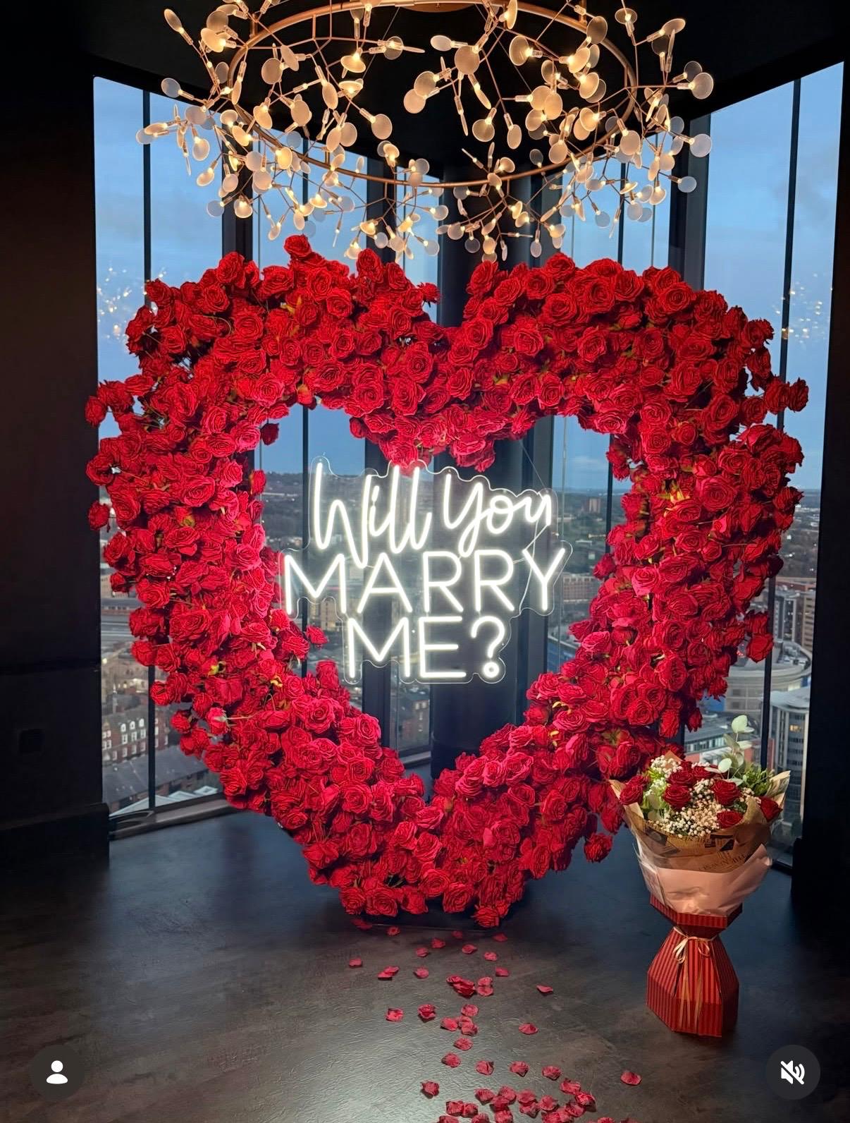 A romantic table set for a proposal at 3Sixty, with the Newcastle skyline at golden hour