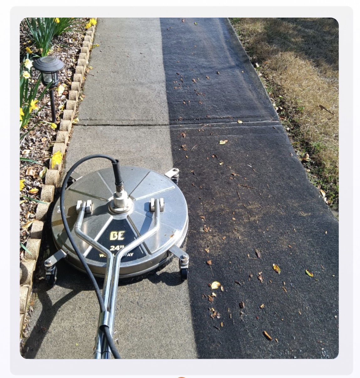 Mechanical Magic pressure washing a walkway in Canton GA — half dirty half clean showing dramatic results