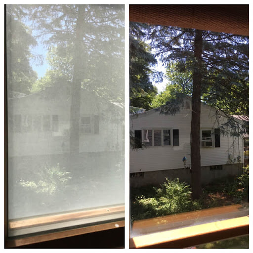 Foggy opaque window cleaned to reveal clear view of neighborhood trees and house in Canton GA