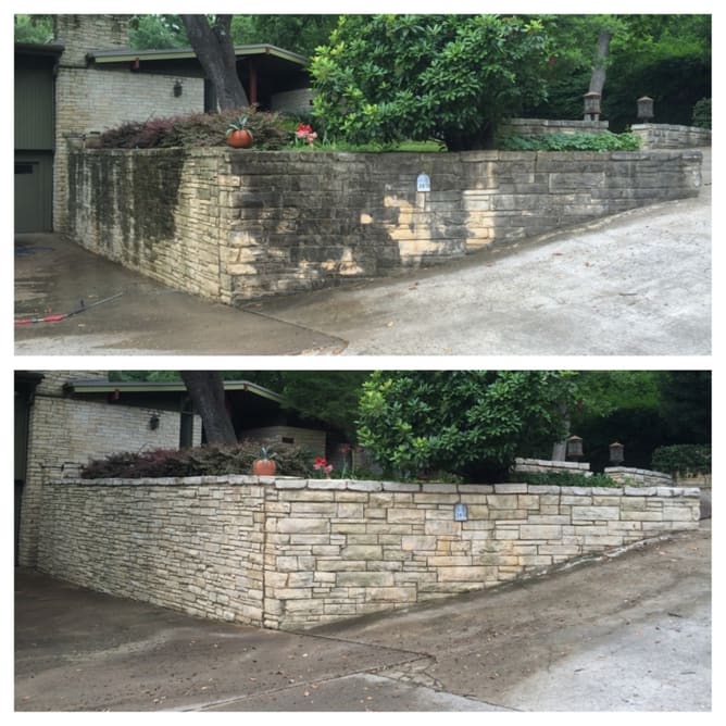 Stone retaining wall cleaned showing mold and algae removed from surface