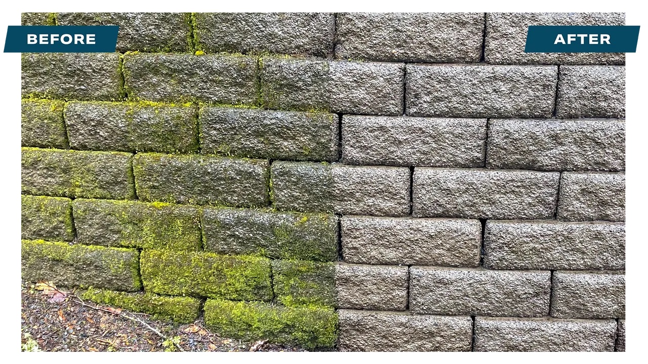 Large retaining wall before and after pressure washing showing dramatic transformation in Canton GA