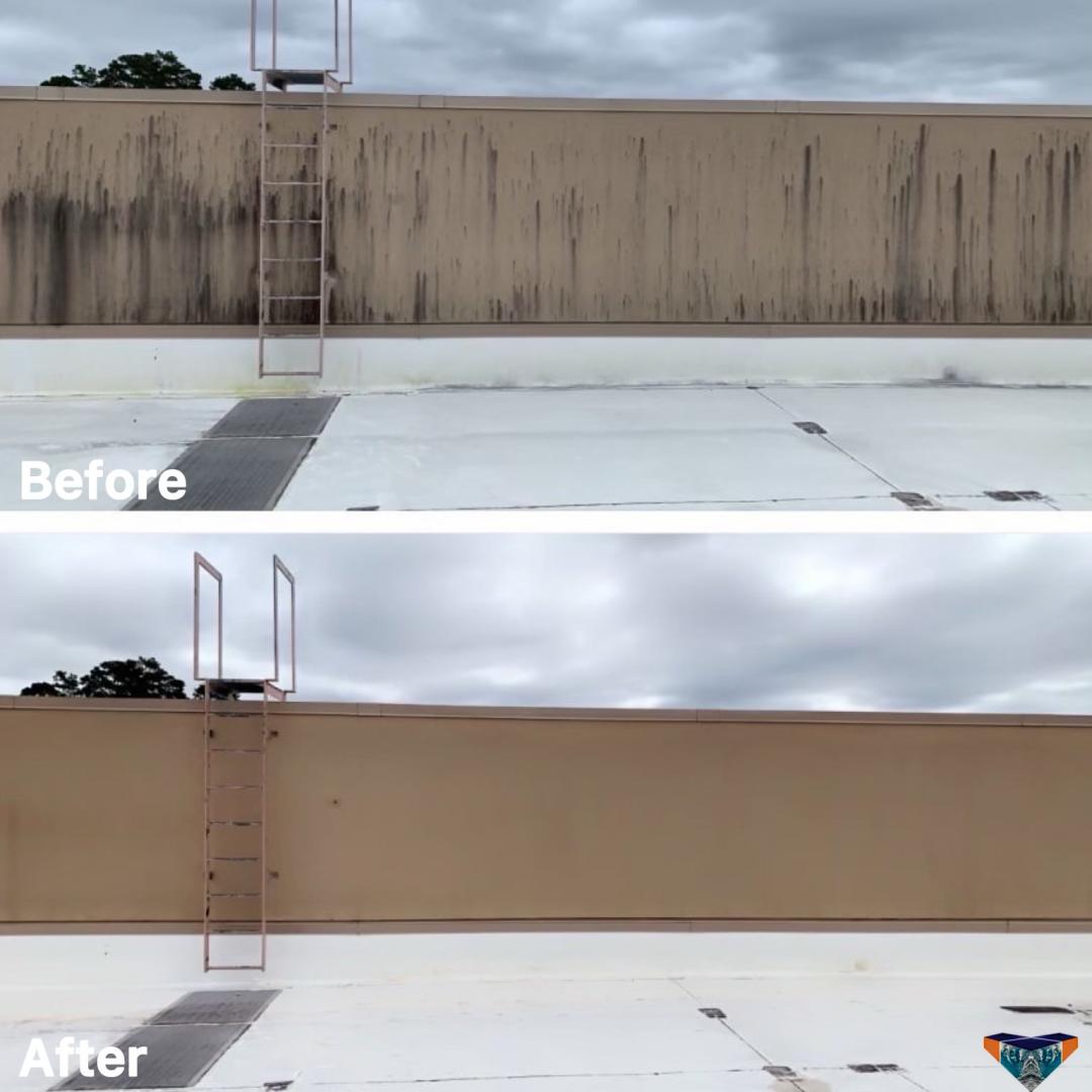 Building stucco siding with heavy black water staining before and after pressure washing