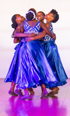 A young dancer mid-movement at a Rhythm of Hope community event