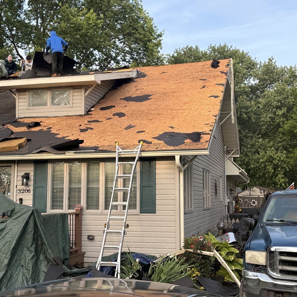 Shingle tear-off with decking exposed