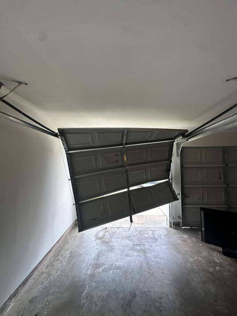 Old damaged garage door - before full replacement