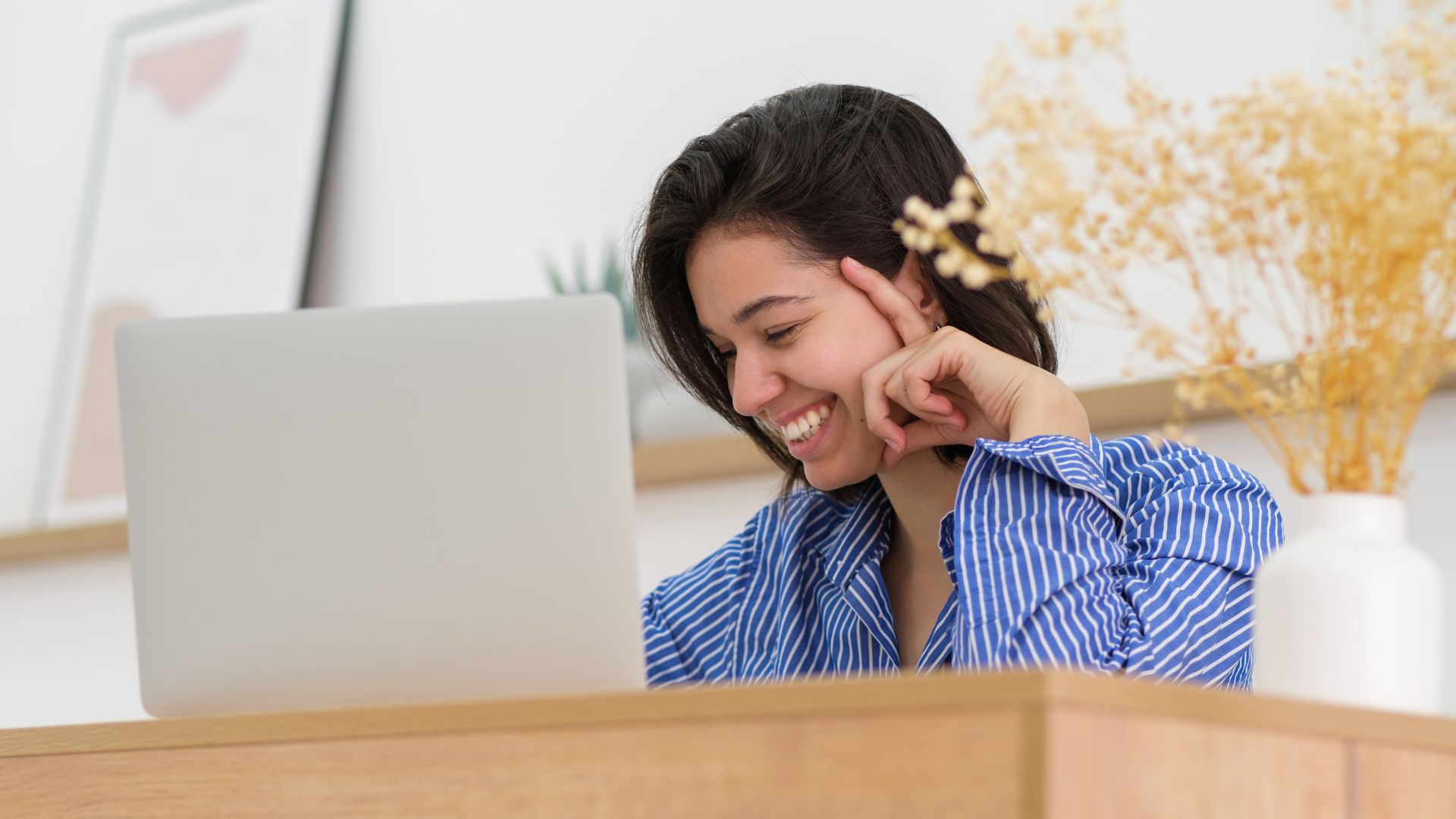 Adult professional taking an online English lesson at home