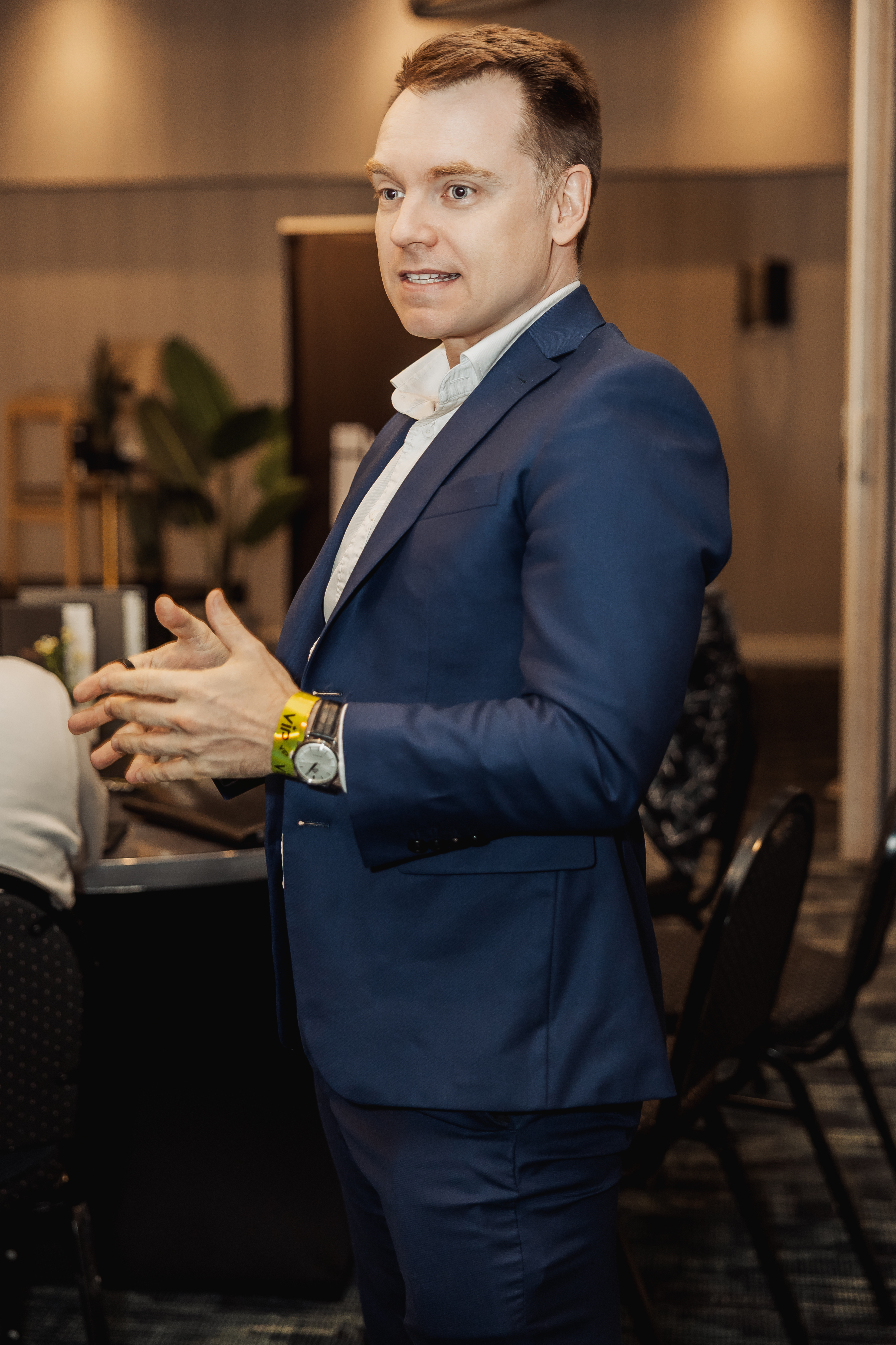 Ezra Dewolfe talking with business owners at a Systems to Scale event
