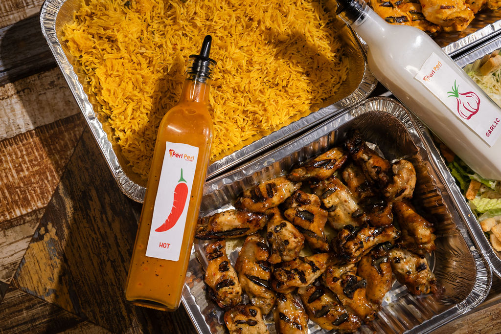 Catering close-up with chicken wings and yellow rice