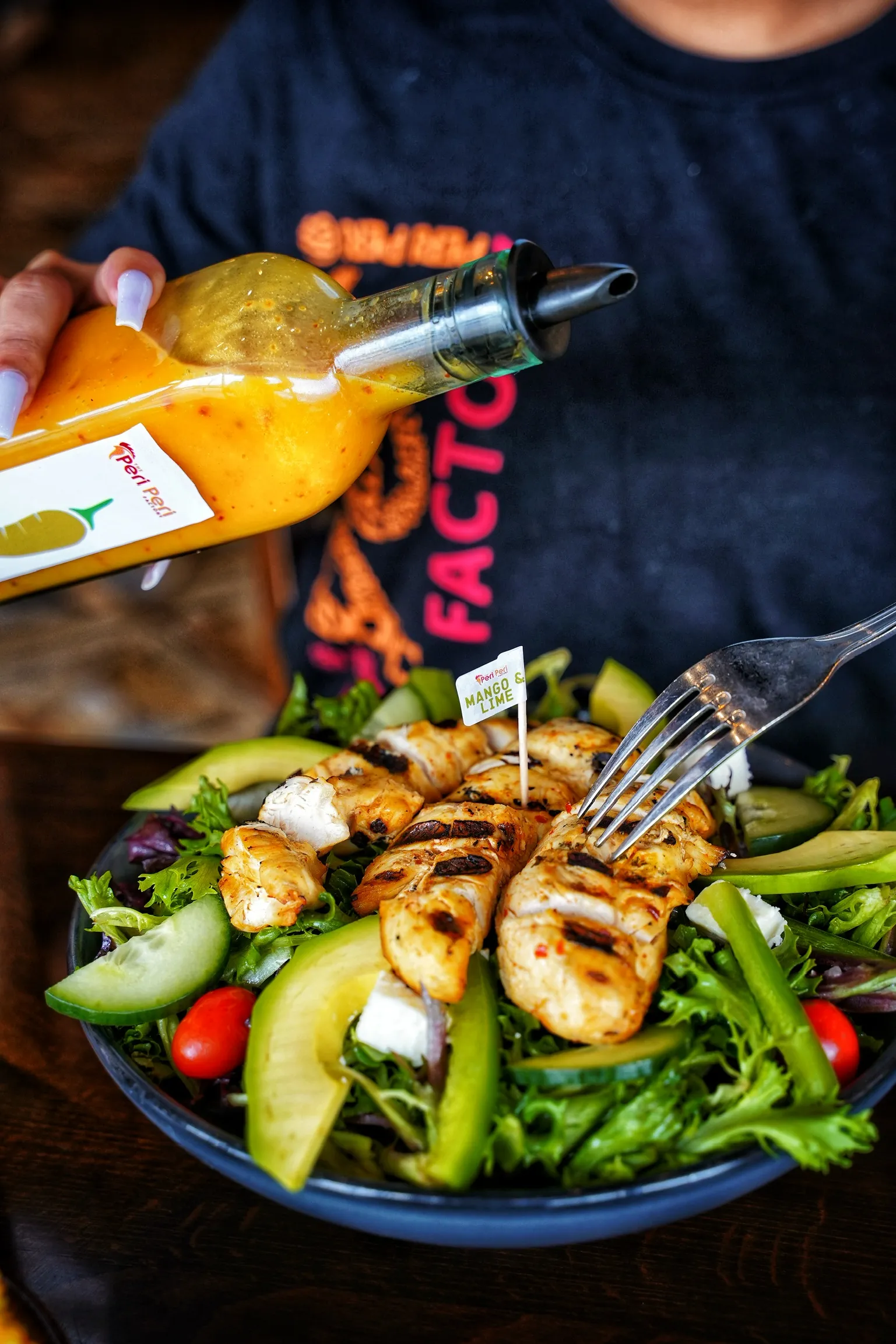 Grilled sliced peri peri chicken over yellow rice