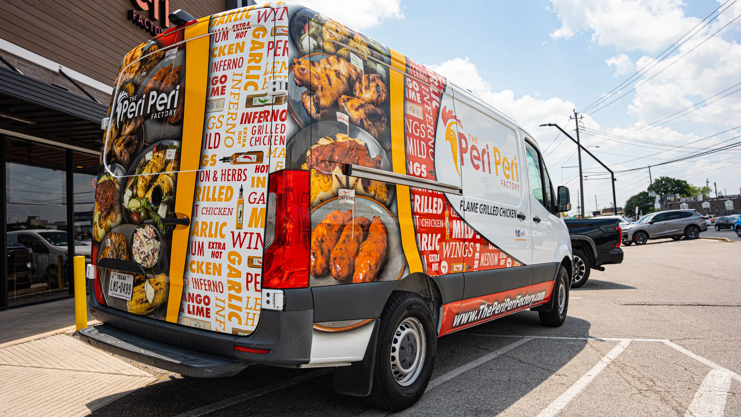 The Peri Peri Factory catering spread with grilled chicken, falafel, salads and sauces