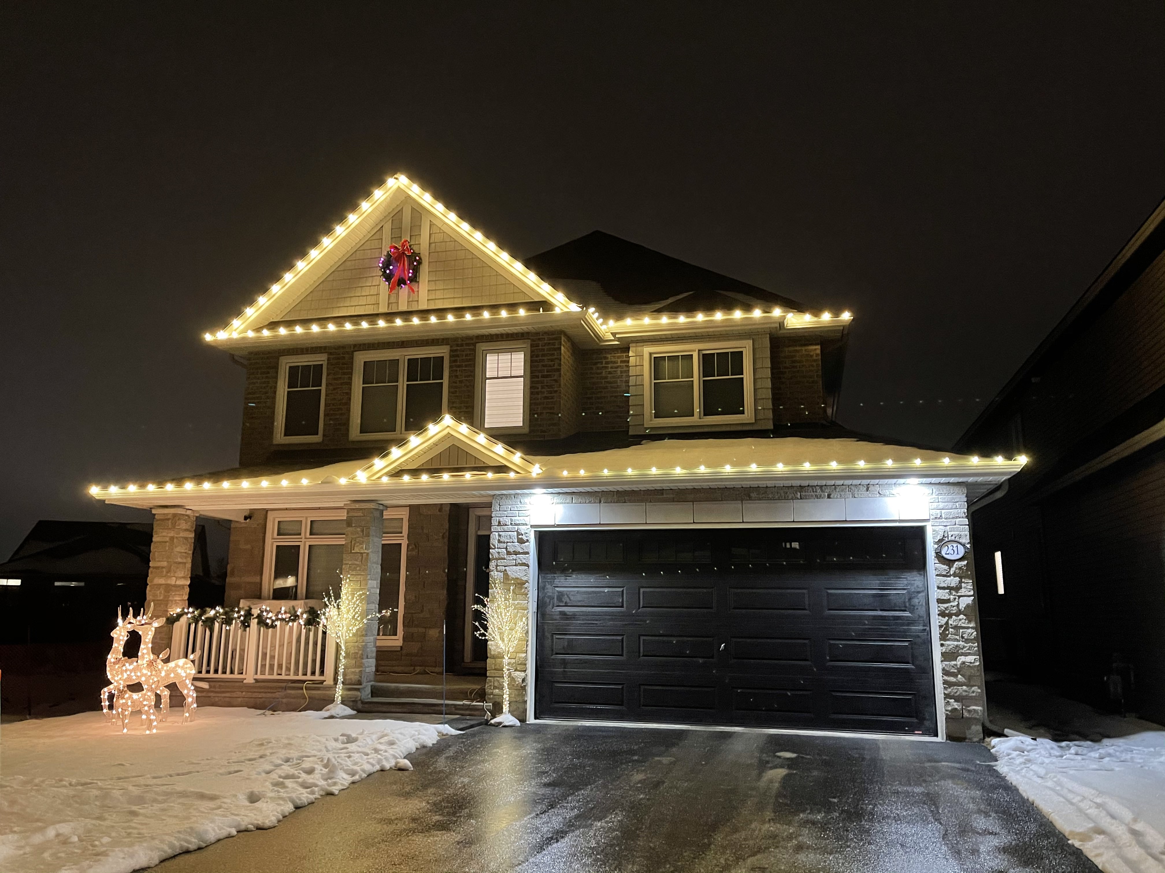 Elegant row of warm white C9 bulbs tracing a snowy roofline at dusk, each bulb perfectly aligned to highlight the home’s architectural peaks Elegant row of warm white C9 bulbs tracing a snowy roofline at dusk, each bulb perfectly aligned to highlight the home’s architectural peaks