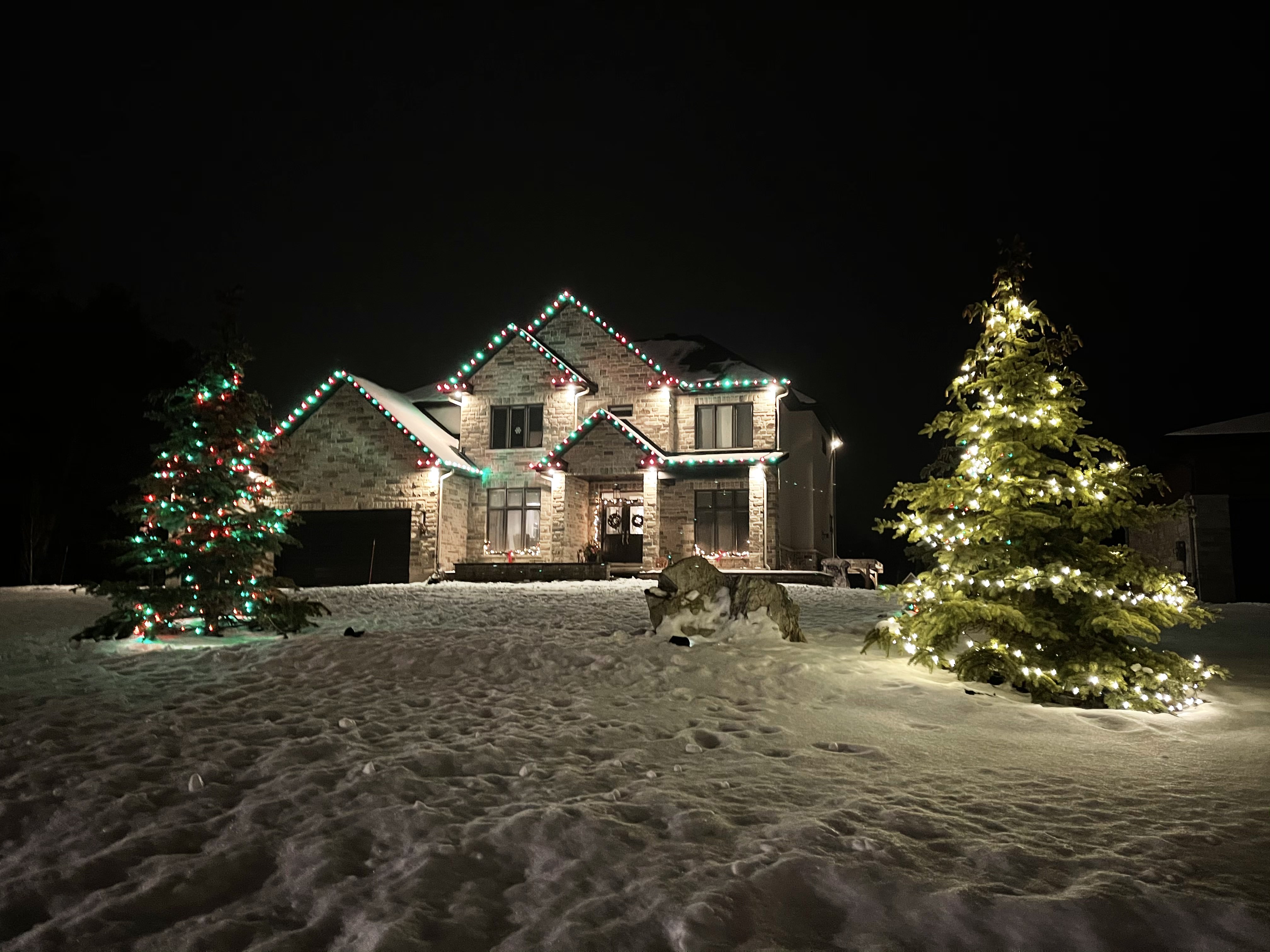 Three seasonal photos of the same home: first with simple warm white roofline, then bold red-and-white candy cane pattern, then expanded coverage highlighting new architectural details Three seasonal photos of the same home: first with simple warm white roofline, then bold red-and-white candy cane pattern, then expanded coverage highlighting new architectural details