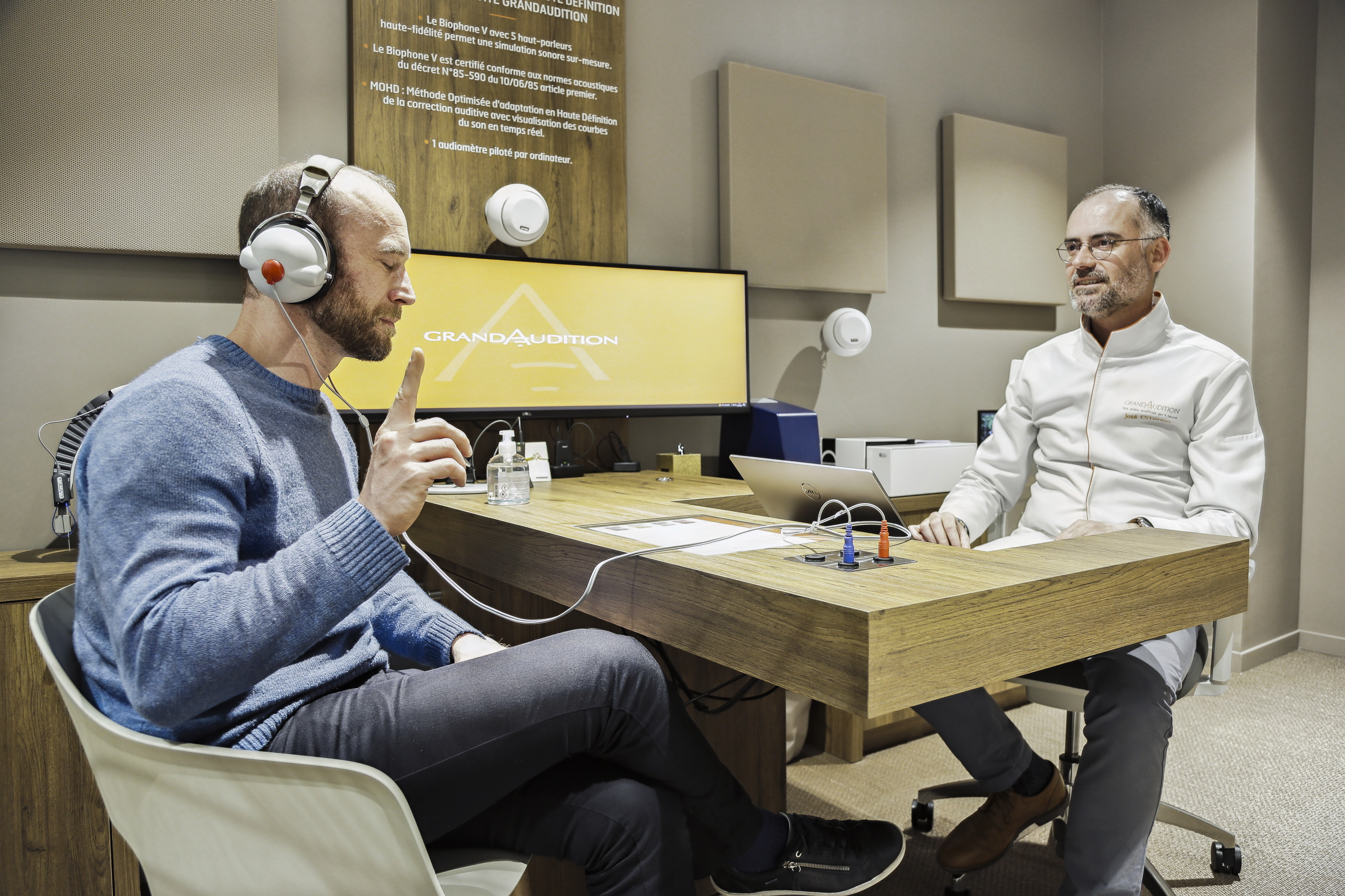 Man in an auiometry exam at a Grand Audition Clinic