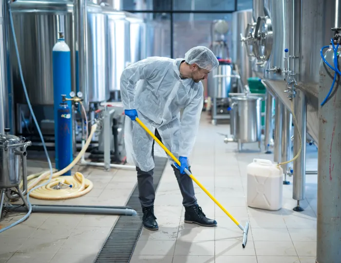Facility cleaner servicing an educational institution floor