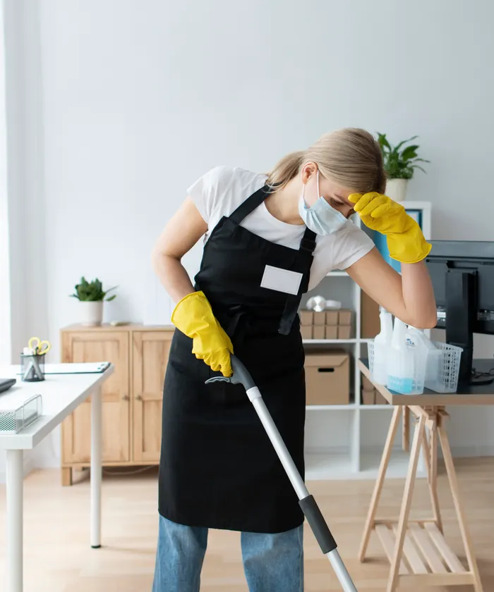 Cleaning staff member with supplies