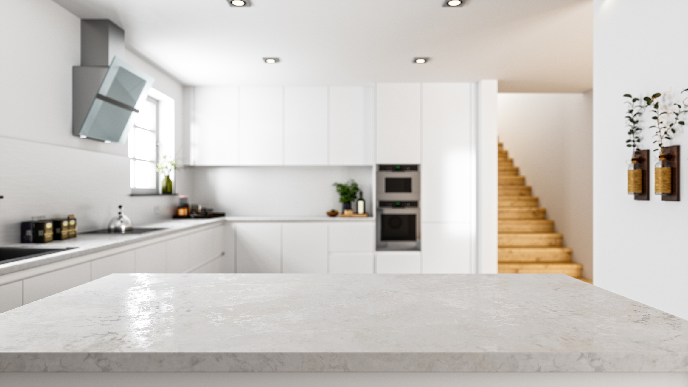 Luxury kitchen renovation with marble countertop and white cabinets