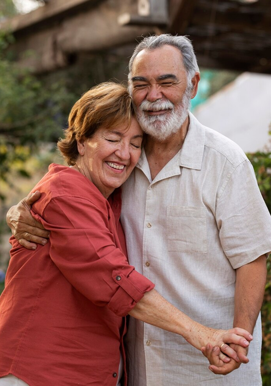 Elderly couple embracing warmly