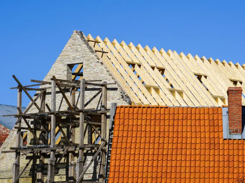 Building under roof renovation with new timber framing and clay tile roofing
