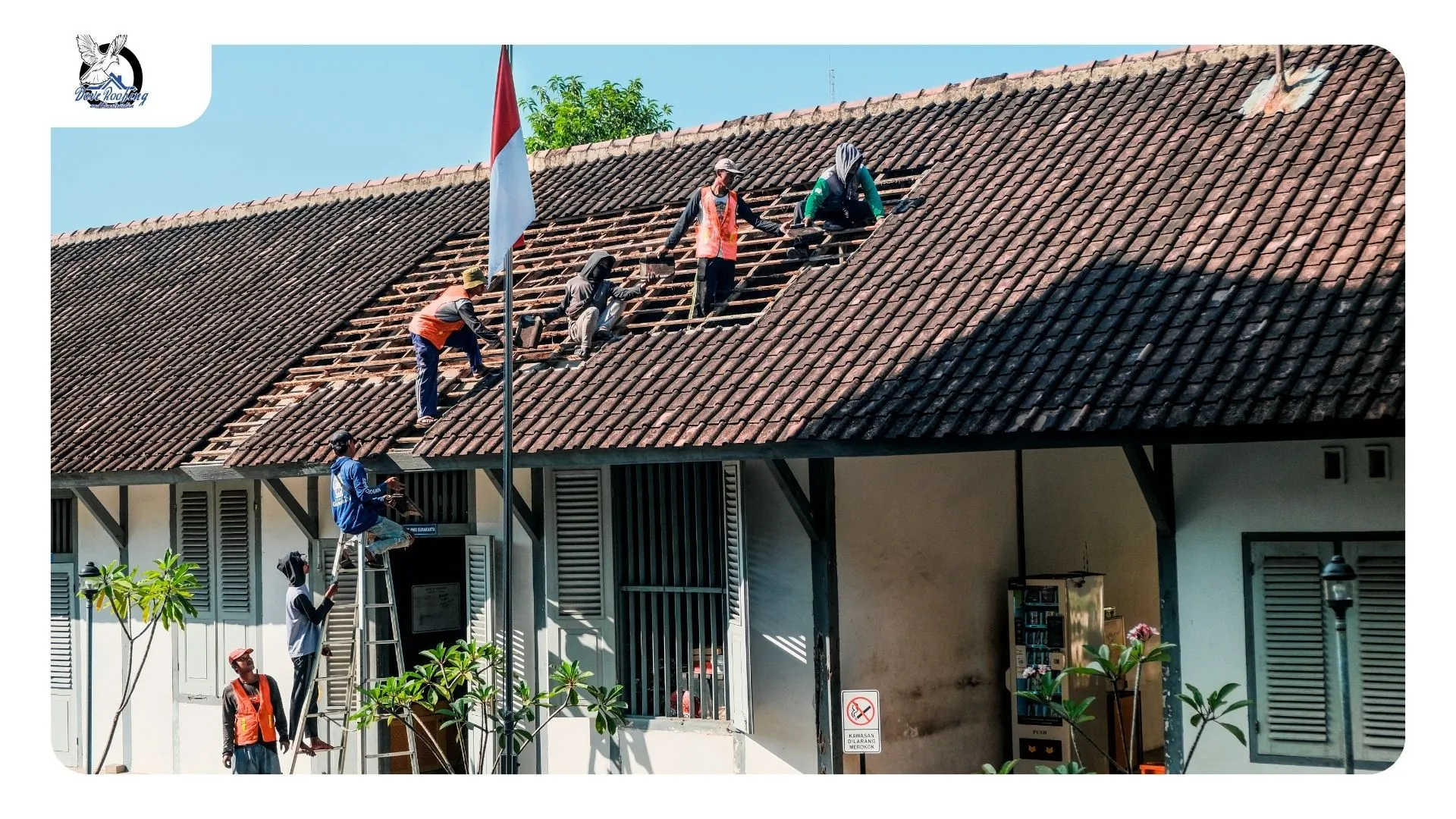 White spray foam roof on a Cathedral City building with a worn coating section near a scupper