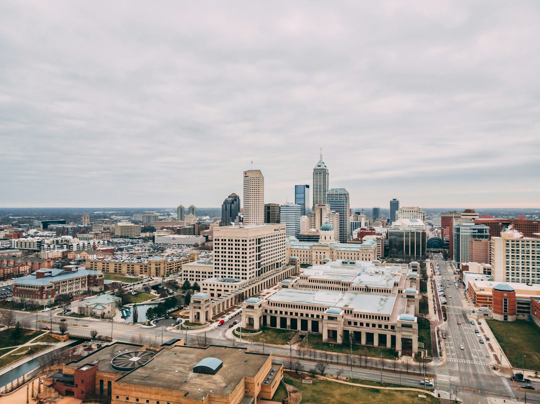 Aerial view of downtown Indianapolis skyline and government buildings under an overcast winter sky.