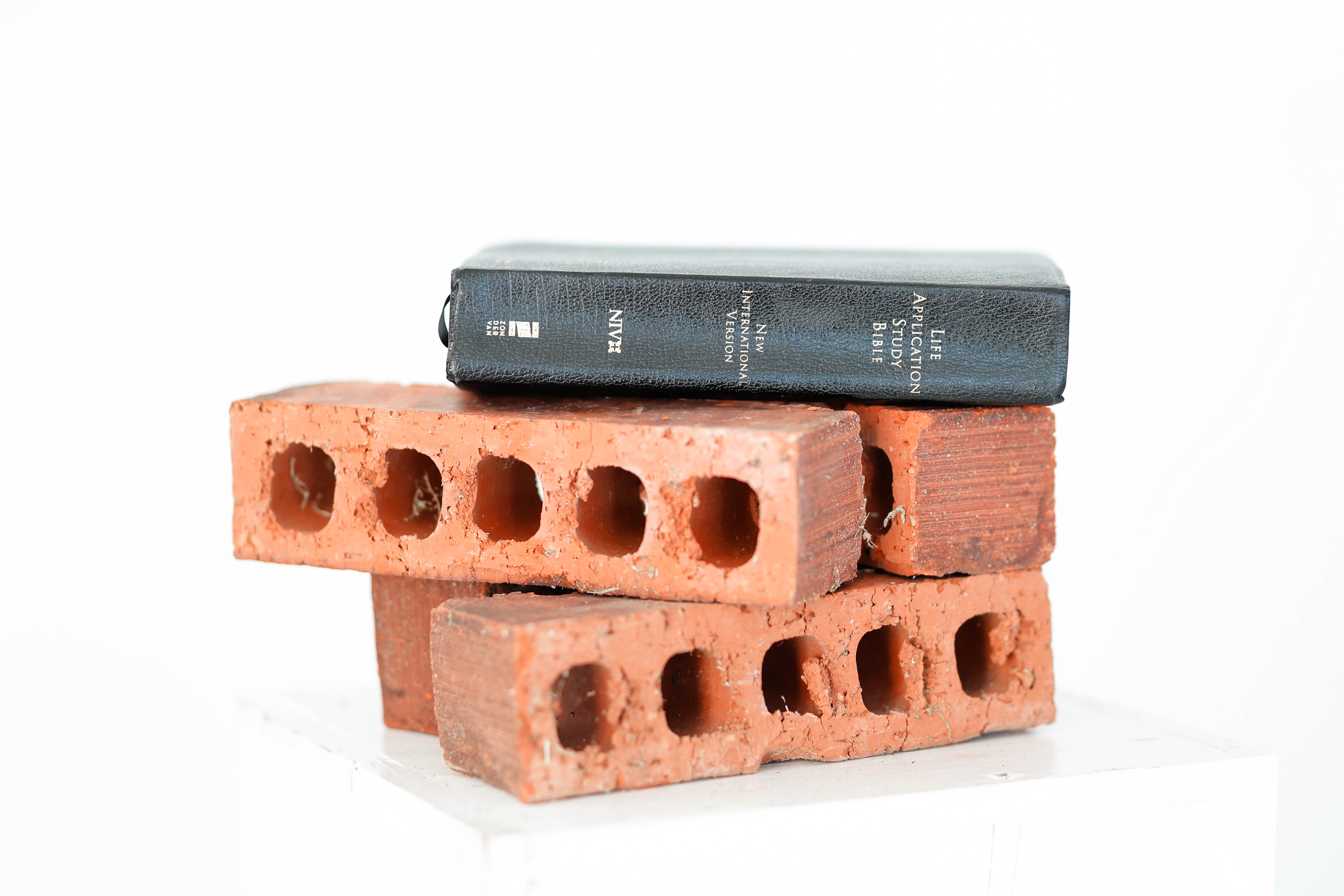An open Bible resting on a wooden table