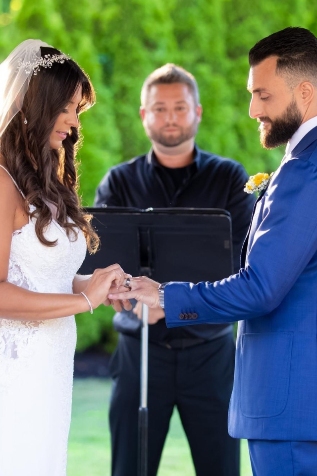 Couple exchanging vows in a rustic barn chapel
