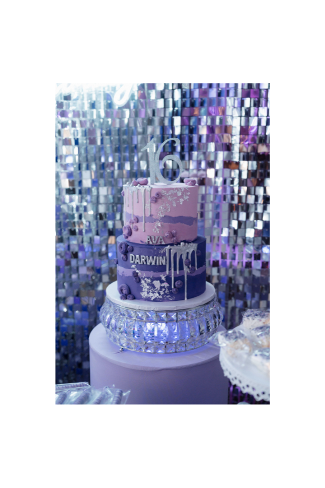 Sweet 16 cake in front of a sequin wall